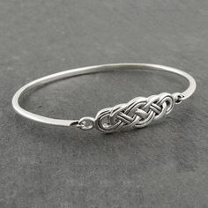 TAKE AN ADDITIONAL 20% OFF THE ALREADY REDUCED SALE PRICE - ADDITIONAL 20% IS DEDUCTED AT CHECKOUT with code SAVE20 Solid Sterling Silver Whether you want to lift your spirits with the power of this ancient Celtic knot, or embrace your past, present and future, the Celtic Love Knot Silver Bracelet is a beautiful reminder of the never ending love in your life. This Celtic knot work bracelet to celebrates Celtic Heritage and captures the intricate knot work designs that have inspired mankind for a Celtic Knot Bracelet, Knot Jewelry, Celtic Love Knot, Knot Bangle, Celtic Heritage, Tree Of Life Jewelry, Celtic Knot Ring, Wiccan Jewelry, Jewelry Knots