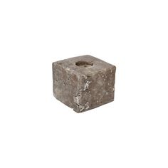 a stone block with a hole in the middle