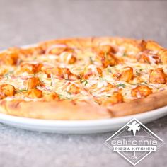 a pizza sitting on top of a white plate