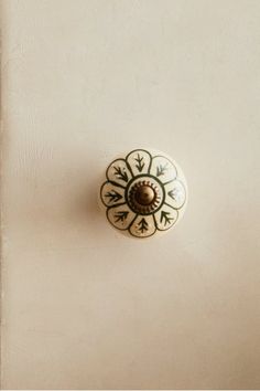 a white door with a decorative knob on it