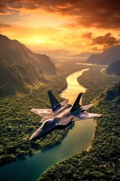 a fighter jet flying over a lush green forest covered valley under a cloudy sky at sunset