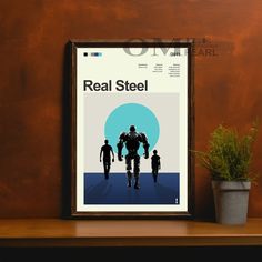 an image of a real steel movie poster on a shelf next to a potted plant