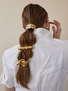 The Glossy Double Arch Pony gives an upgrade to your basic pony. The geometric arch on this piece adds an edge to your hairstyle. Available in Rhodium and 14K Gold. Made in NYC. Geometric Arch, Hair In A Ponytail, Hair Loop, A Ponytail, Elastic Hair Ties, Hair Rings, Metallic Hair, Gold Hair, Scrunchie Hairstyles