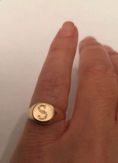 "Pinky ring, Engraved ring, Initial Ring, Personalized Ring Engraved Signet ring with Round Seal- Best quality 18k Gold Plate Engraved 1 letter - Vintage style Diameter: 0.7 mm = 0.27\" Please note in the \"notes to seller\" at checkout. : * state your ring size * letter you want to apper The product will arrive to you packed in gift box and padded envelope to maintain the product Our jewelry are water resistant and comes with 1 year warranty Thank you for your interest. Please check out our oth Yellow Gold Si Clarity Rings, Initials Engraved White Gold Ring, Personalized Gold Initial Ring, Personalized Gold Initial Ring With Round Cut, Personalized Initial Ring In Gold With Round Cut, Initials Engraved Round Band Jewelry As Gift, Rose Gold Round Initial Ring Hallmarked, 14k Gold Jewelry With Initials On Round Band, Adjustable 14k Stamped Initial Ring