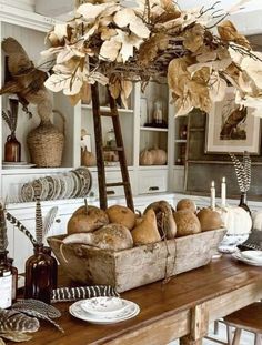 a wooden table topped with lots of bread