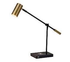 a black and gold desk lamp with a metal base on a white background the light is turned off