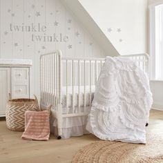 The Skylar Nursery Collection is inspired by Soft Cascading Ruffles. The 4 Piece Crib Bedding Set includes a Quilt, Fitted Sheet, Wall Decal & Crib Skirt/Dust Ruffle. The quilt features tiered, ruched bed skirt, 100% Cotton Crib Fitted Sheet with a simple grey trellis pattern, and wall decal with stars and the words "twinkle twinkle." Adding white accents, this design will transform your child's room! Baby Crib Bedding Sets, Baby Crib Bedding, Nursery Accessories, Crib Sets, Baby Nursery Furniture, Nursery Set, Crib Bedding Sets, Fitted Crib Sheet, Nursery Bedding