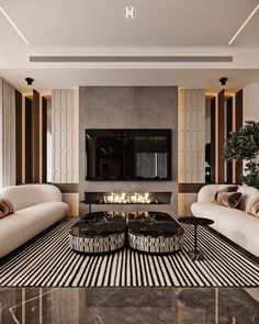 a living room with two couches, a coffee table and a television mounted on the wall