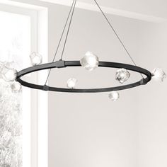 a circular chandelier hanging from the ceiling