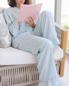 Indulge in ultimate comfort with our Baby Blue Daynaps Pajama. Made of bamboo fabric in stunning azo free dyes, this pajama can be worn day and night. With feminine ruffle details, elastic waist, and button closure, it offers a luxurious fit. Plus, it's machine washable for easy maintenance. The luxurious Baby Blue Daynaps Pajama will be shipped in January 2025. As a special touch, each order includes a beautifully illustrated card and a unique QR code that grants access to a collection of medit Blue Sets For Lounging With Long Pants, Blue Pjs Pajama Set, Blue Lounge Sets With Long Pants, Blue Lounging Sets With Long Pants, Light Blue Cotton Sleepwear For Pajama Party, Light Blue Cotton Sleepwear For Sleepover, Light Blue Pajama Set, Blue Sleepwear With Elastic Waistband For Relaxation, Playful Light Blue Sleepwear For Bedtime