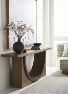 a living room scene with focus on the console table