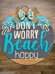 a sign that says don't worry beach happy