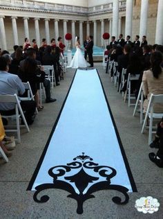 the aisle is decorated with black and white designs