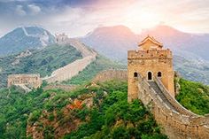 the great wall of china with mountains in the background