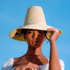 KEMALA is a very special piece designed with beautiful sunny summer days in mind. This piece should be an essential part of any outfit, especially for every island getaway. Crafted from lightweight natural palm straw, KEMALA hat has a high crown and wide down-turned brim to safely protect from the sun’s harsh rays.  DETAILS Composition: 100% Natural Palm Straw Made in Bali, Indonesia Spot clean Adjustable Natural Panama Hat For Poolside, Lightweight Natural Straw Hat For Vacation, Natural Lightweight Straw Hat For Vacation, Natural Woven Sun Hat For Vacation, Summer Festival Panama Hat Made Of Palm Leaf, Summer Palm Leaf Panama Hat For Festival, Summer Festival Panama Hat In Palm Leaf, Natural Straw Hat For Beachwear, Natural Color Beachwear Sun Hat For Beach Season