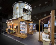 the inside of a store with various items on display and in front of it is a round metal structure