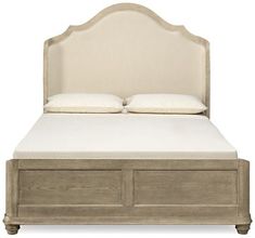 an upholstered bed with two drawers underneath it