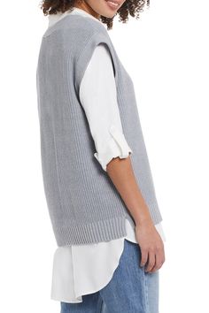 The hottest trend this season is a sweater vest over a long sleeve shirt. Our Silvia sweater vest in grey mix is the perfect style to show off this trend! V-neck, wide band hem and cap sleeve design gives this sweater vest ultimate flair. Layer over our WYLER WHITE ROLL UP SLEEVE SHIRT (pictured) for the perfect trendsetting look! Final Sale- No returns or exchanges. Color- Grey mix. V-neck design. Wide band hem. Cap sleeves. Fabric- 60% Cotton. 40% Acrylic. Care-Hand wash separately in cold. Do Fall Sweater Vest For Layering, Winter Layering Sweater Vest, Casual Gray Sweater Vest For Fall, Gray Sweater Vest For Layering, Gray Knit Sweater Vest For Spring, Gray Vest Top For Fall, Gray Sweater Vest For Spring Layering, Spring Gray Knit Sweater Vest, Gray Sweater Vest For Fall