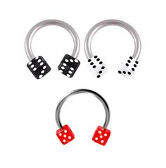 three dices and two rings with red dots on them