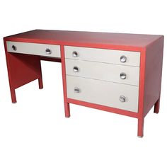 a red and white desk with two drawers on each side, against a white background