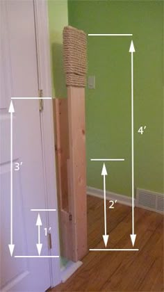 the height of a cat tree is shown in this room with measurements for each pole