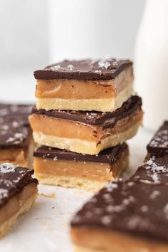 chocolate and peanut butter bars stacked on top of each other