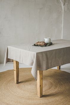 a table with a cup on it and a saucer sitting on top of it