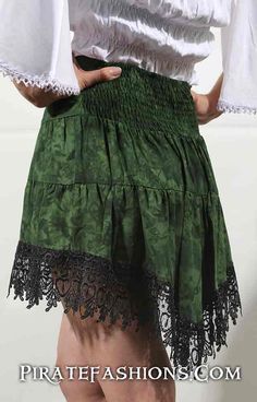 This be the new improved Sassy Sea Skirt. It be high in the front, low in the back with lacy all around the edge. Perfect fer the wench who be wanting to show a lot of leg, yarrrr!• Made of a 100% cotton fer hot days n' even hotter nights• Elastic waistband in the back with a 4.5 waistband in front• Great fer layering on top of other skirts, such as the lacy duchess• Comes in 4 different colors which match the lady pirate blouse n' saucy wench top. SIZING CHART Small/Med 26 - 36 waist Large/XL 3 Fitted Lace Patchwork Skirt, Bohemian Skirt With Attached Cancan, Lace Ruffled Skirt With Stretch, Lace Ruffled Stretch Skirt, Bohemian Fitted Mini Skirt, Skirted Stretch Bottoms With Lace Trim, Fitted Bohemian Skirt With Attached Cancan, Stretch Tiered Skirt With Lace Trim, Stretch Skirted Bottoms For Festival