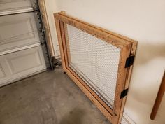 a large wooden gate sitting next to a garage door