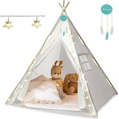 a teepee tent with two stuffed animals in it