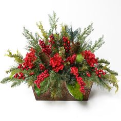 a potted plant with red berries and greenery in it on a white background