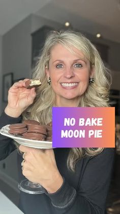 a woman holding a plate with cookies on it that says no bake moon pie