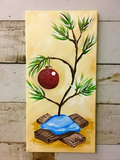 a painting on a wall with a tree and a ball hanging from it's branch