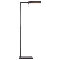 a black floor lamp with a dim light on the top and an arm that is attached to it