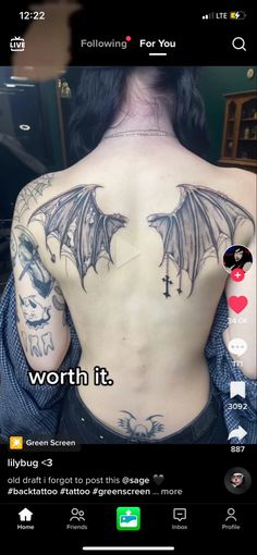 the back of a man with tattoos on his chest and shoulder, which reads worth it