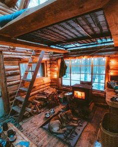 an old log cabin with wood burning stove