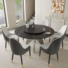 a dining table with four chairs around it