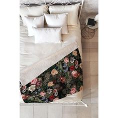 an overhead view of a bed with flowers on it