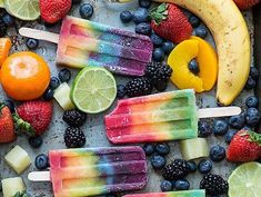 popsicles with fruit, lemons, strawberries and bananas on a tray