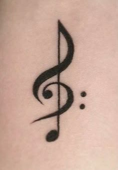 a tattoo with a musical note on it