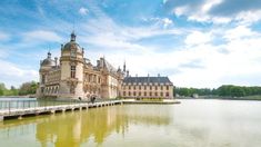 a large building sitting on top of a lake