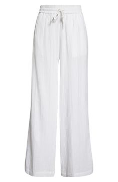 Cut from soft cotton gauze, these cover-up pants feature handy pockets and an easy-fitting drawstring waist. 29" inseam; 27 1/2" leg opening; 13 1/2" front rise; 18" back rise (size Medium) Drawstring waist Side-seam pockets 100% cotton Machine wash, line dry Imported Chic Cotton Beach Pants, Chic Cotton Pants For Beach Season, Cotton Pants For The Beach, Relaxed Fit Cotton Pants For Beach Season, Wide-leg Relaxed Fit Beachwear Pants, Relaxed Fit Wide-leg Beachwear Pants, Cotton Beachwear Pants, White Breezy Loungewear Bottoms, Breezy White Loungewear Bottoms