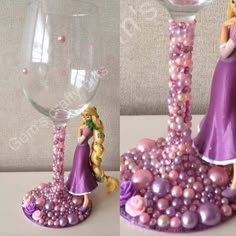 there is a glass with beads and a figurine in it on the table