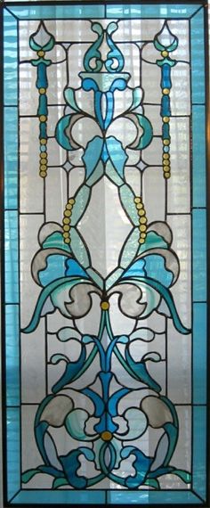 a stained glass window with blue and white designs