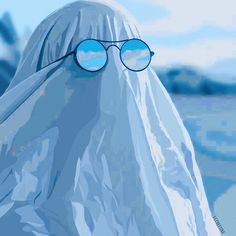 a close up of a person wearing glasses and a plastic bag over their head with the sky in the background