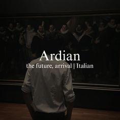 a man standing in front of a painting with the words ardian on it