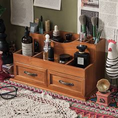 an assortment of beauty products on display in a wooden drawer with price tag for $ 32 82