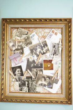 an old framed photo with many photos and pins pinned to the wall in front of it