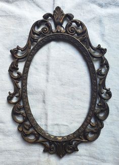 an ornate frame is shown on a white sheet