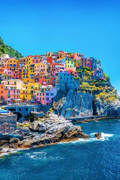 colorful houses on the cliff above the ocean in cinque terrara, italy